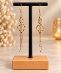 ✨ Kaneore – Boucles d’oreilles pendantes dorées torsadées à strass
