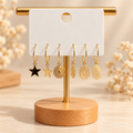 ✨✨✨ Créoles dorées avec breloques étoiles et motifs ajourés